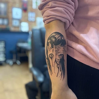 Fine line surreal tattoo of a girl's face with a long-fingered hand laid across one side, small detailed eyes along the fingers and a large detailed eye in the palm, with ink drips running from the hand and hair, on an outer forearm