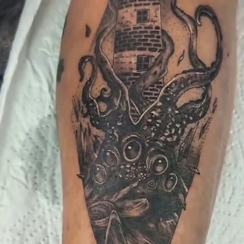 Black and grey realism tattoo of a lighthouse wrapped in the suckered tentacles of a kraken, shaded with heavy stippling inside a tall triangular frame