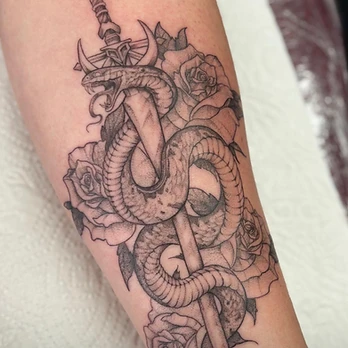 Fine-line black and grey tattoo of a sword entwined with a coiled snake with its mouth open, surrounded by three roses, on a forearm