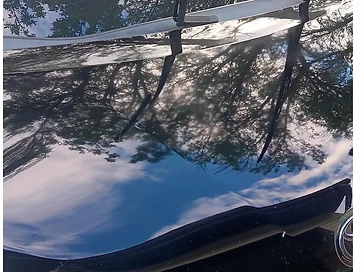 Black vehicle after professional paint correction with restored gloss – Mack2Steam La Crosse WI
