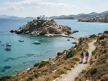 The rocky headland, small monastery and sheltered bay of Paros Park.