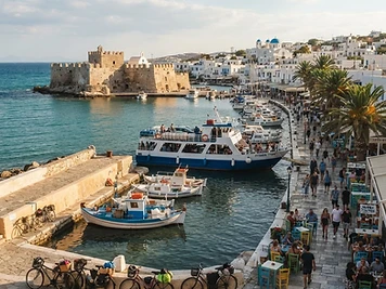 The waterfront promenade of Kos Town with its castle at the harbour mouth and bicycles parked along the quay.
