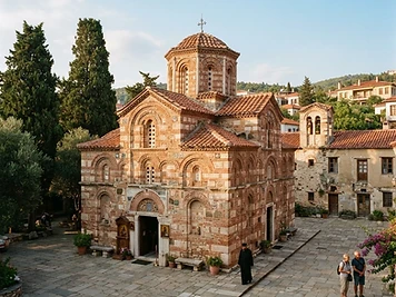 The eleventh-century domed church of Nea Moni on Chios, in brick and stone, with cypresses in the courtyard.