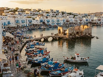 Fishing boats and whitewashed houses around the small harbour of Naoussa, Paros.