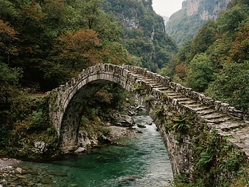 An old stone packhorse bridge over a mountain river in Zagori