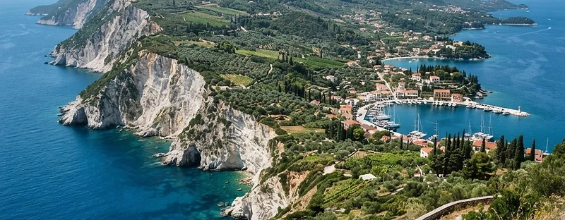 The green coastline of Zakynthos, with olive groves and cliffs dropping to the Ionian Sea.
