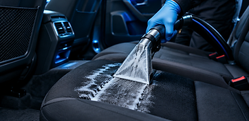 Extraction wand sanitizing a car seat after a spill incident