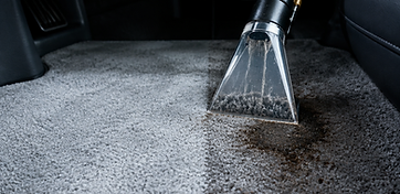 Extraction tool pulling a stain out of car carpet