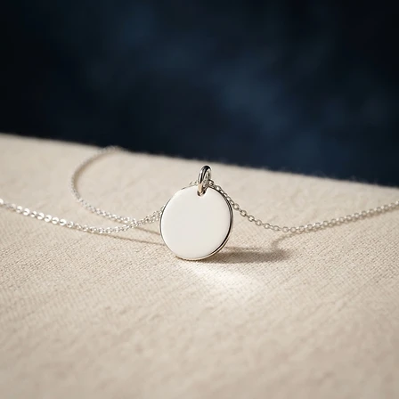 The Healexus System — a polished silver energy pendant