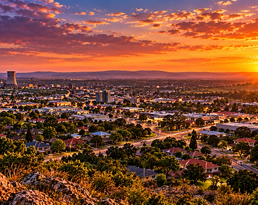 Golden-hour view over a South African city, the kind of setting used for advertiser profile photography