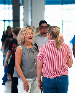 Two guests laughing in the lobby