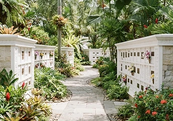 Curving garden path lined with white columbarium walls