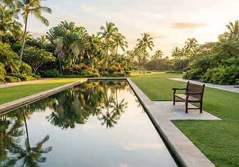 Quiet reflecting pool bordered by stone and lawn