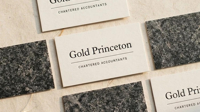 Gold Princeton business cards flat lay
