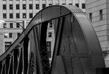 The riveted steel arch of the LaSalle Street Bridge in Chicago.