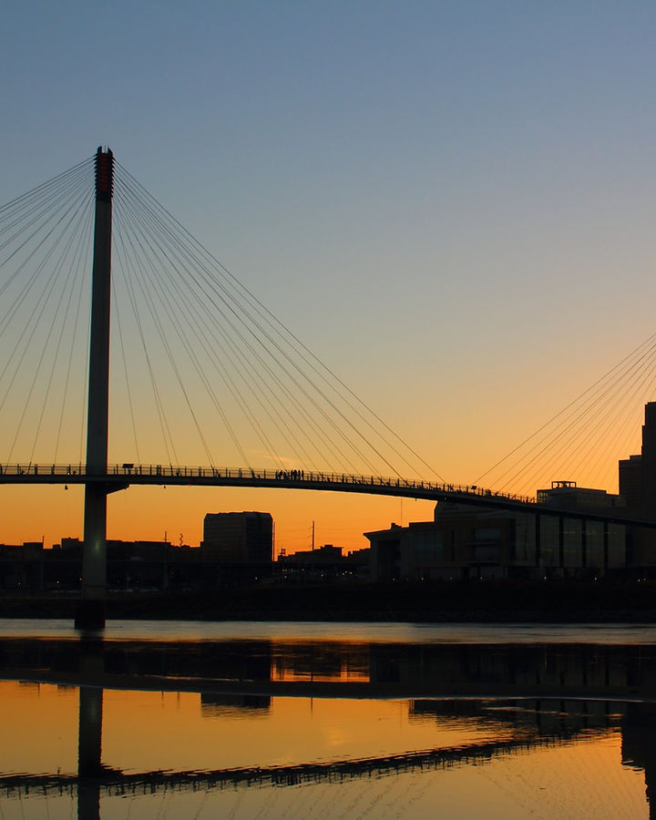Bob Kerrey Pedestrian Bridge in Omaha, Nebraska, at sunset.