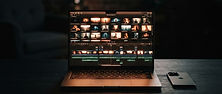 Founder's laptop showing a product launch video timeline with cinematic AI-generated clips
