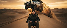 Person sitting calmly in a folding chair on a desert dune while an SUV flies through the air behind them