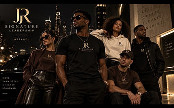 The JR Signature crew wearing Signature and Developed pieces together on a city street at night — more than style, a higher standard