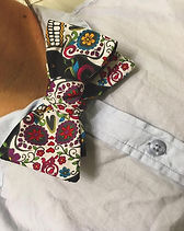 Lacie wearing a Day of the Dead pattern bow tie