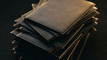 Gold bull emblem glowing above sleeved trading cards on a dark background