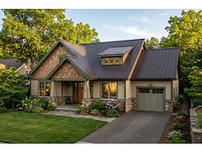Two-story craftsman home with a dark bronze standing seam metal roof