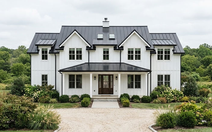 White modern farmhouse with a charcoal standing seam metal roof