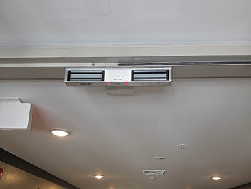 SECO-LARM electromagnetic door lock mounted on a door frame