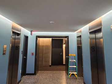 Elevator bank corridor with perimeter cove lighting