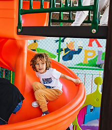 Children enjoying the indoor play area slide
