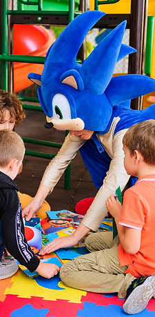 Kids meeting the Sonic mascot in the play zone