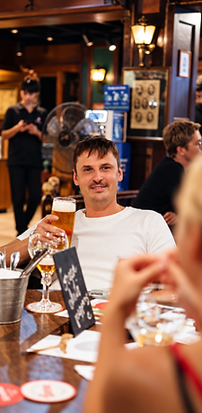 Guest enjoying a pint of beer in the pub