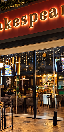 Shakespeare Gastropub exterior at night with illuminated signage