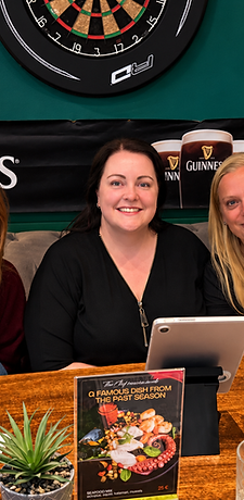 Group of friends relaxing in the pub booth