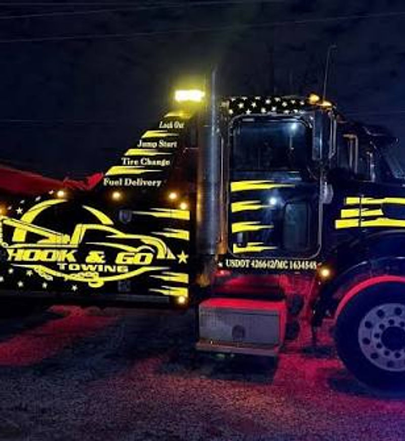 Hook and Go heavy-duty wrecker towing a box truck in St. Louis