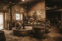 An old Mexican distillery with stone walls evoking the history of agave distillation