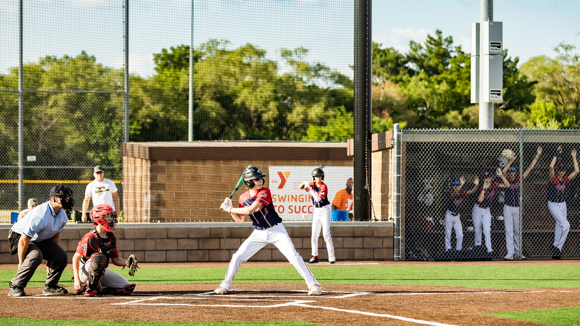 Baseball batter at home plate during a daytime game