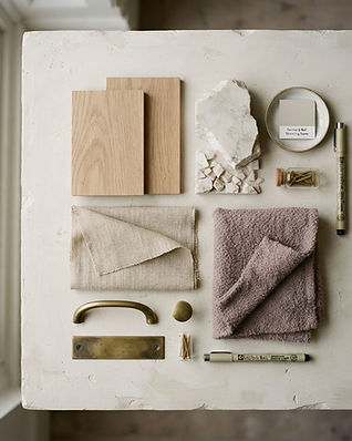 A Pitaya studio detail — material samples and drawings on a workbench
