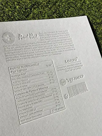 Embossed product information on a white paper card