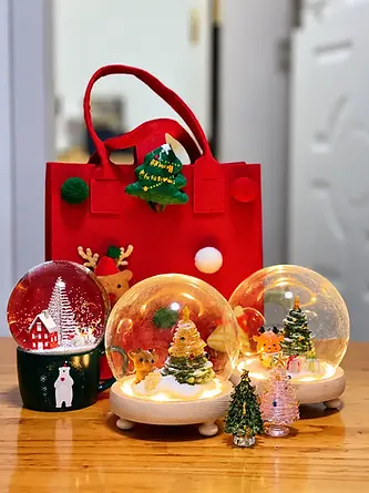 Red fabric carrier bag with seasonal ornaments in a gift presentation