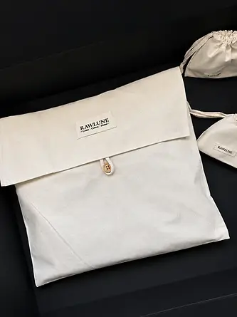 Fabric product pouch with button closure and printed branding