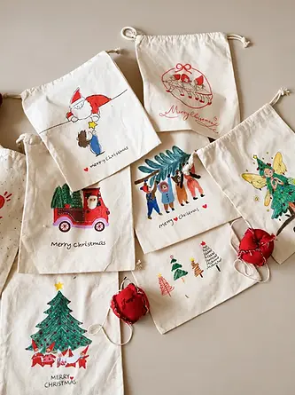 Printed fabric gift bags in several seasonal designs