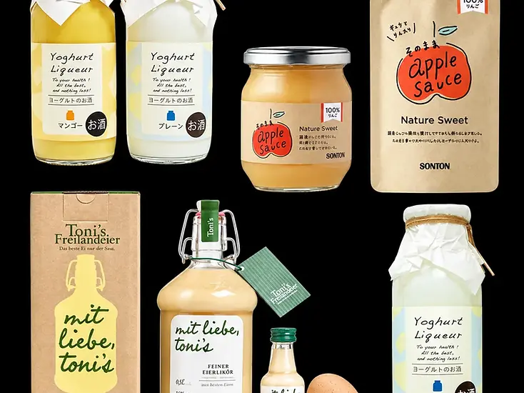 Glass jars and bottles with coordinated labels, wraps and paper cartons