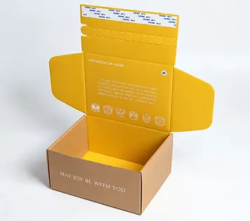 Open kraft mailer box with a yellow printed interior