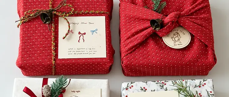 Coordinated Christmas gift packaging with festive wrapping and ribbons