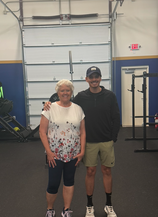 A coach and client together on the training floor at The Lab