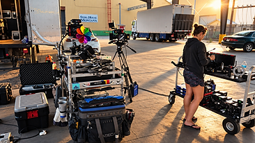Golden hour Montana production basecamp with camera equipment and Story House Montana signage