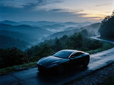 A detailed car on a ridge road in the Smoky Mountains at first light