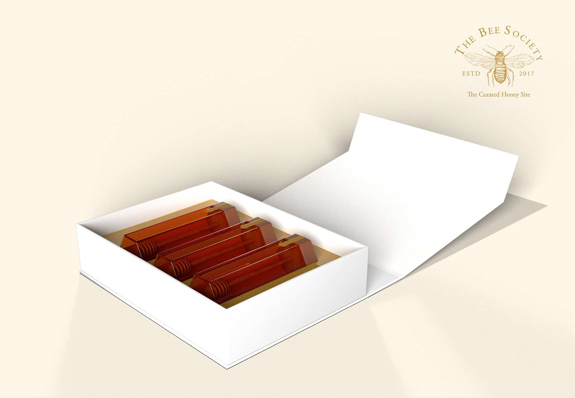 Packaging design created for The Bee Society, shown open with bottles inside.