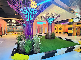 Glowing mini Supertrees along the track at VroomTown Singapore